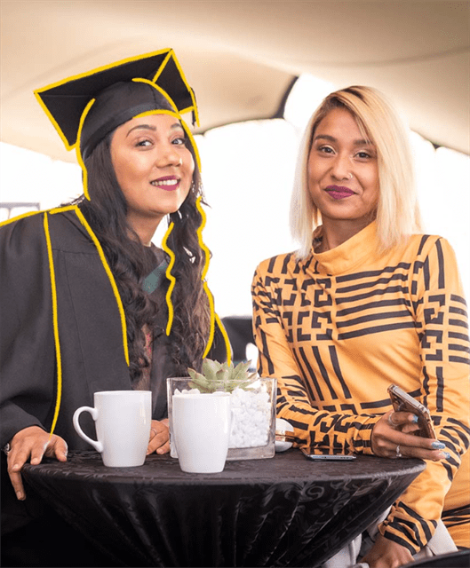 Graduate at table